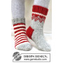 Twinkle Toes by DROPS Design 4 - Strickmuster mit Kit Socken Grau Größen 22-43
